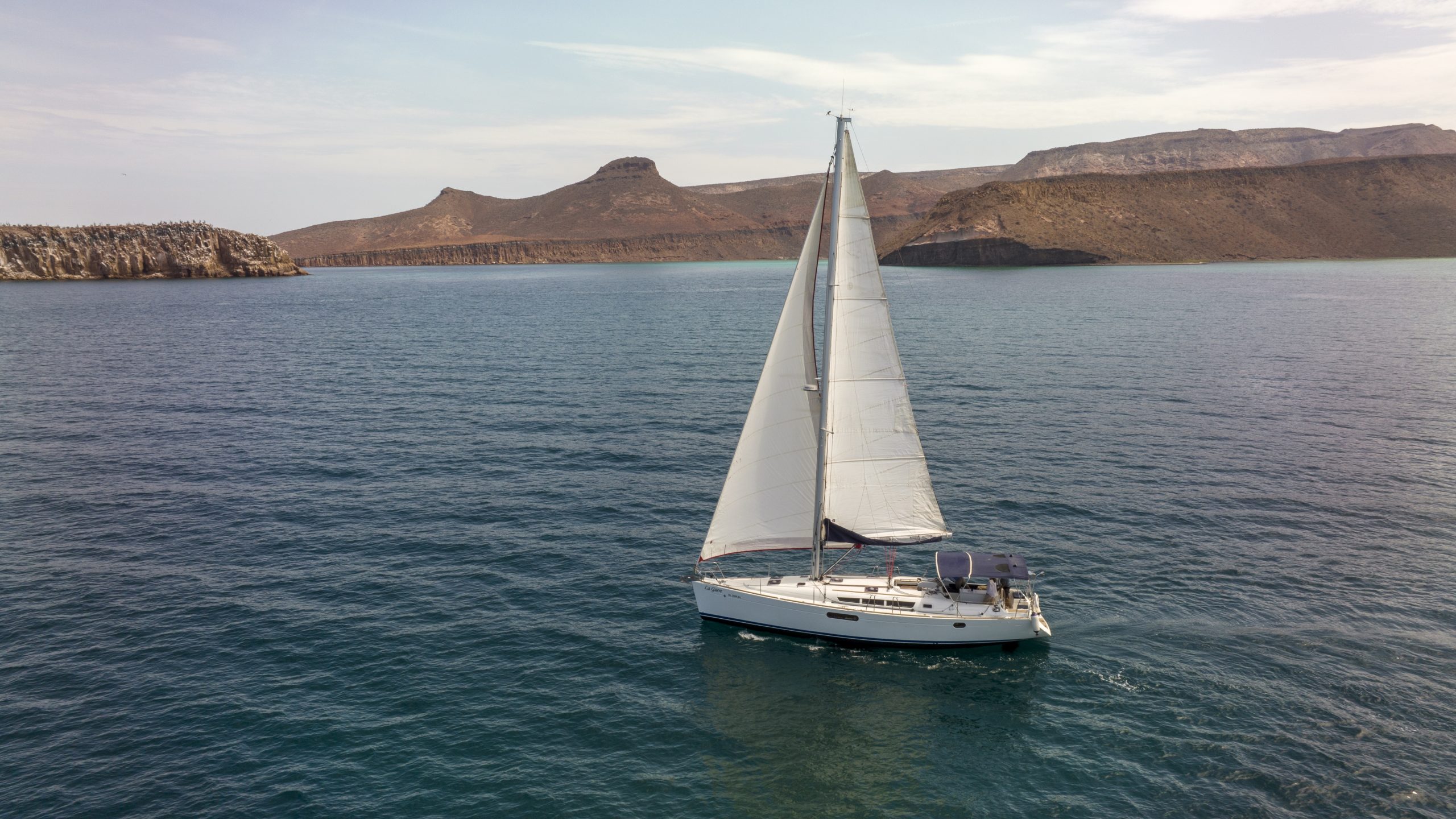 La Santa, a Jeanneau Sun Odyssey 44i, navigating under sail in the Bay of La Paz